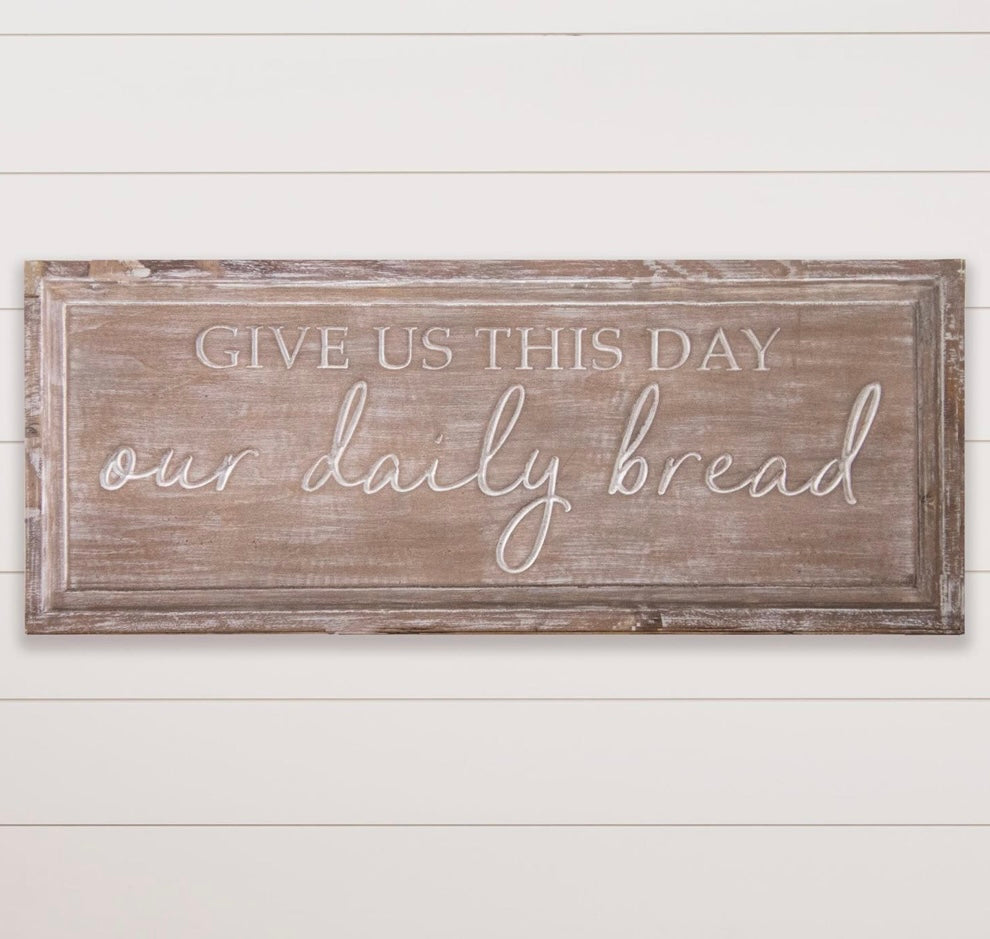 Carved daily bread sign